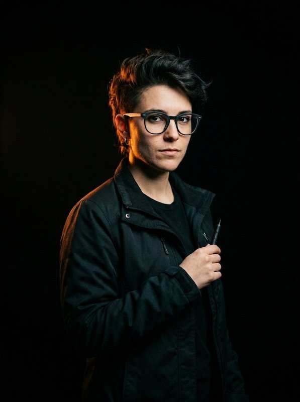Studio portrait of Pim Sletner, duotone void and accent.