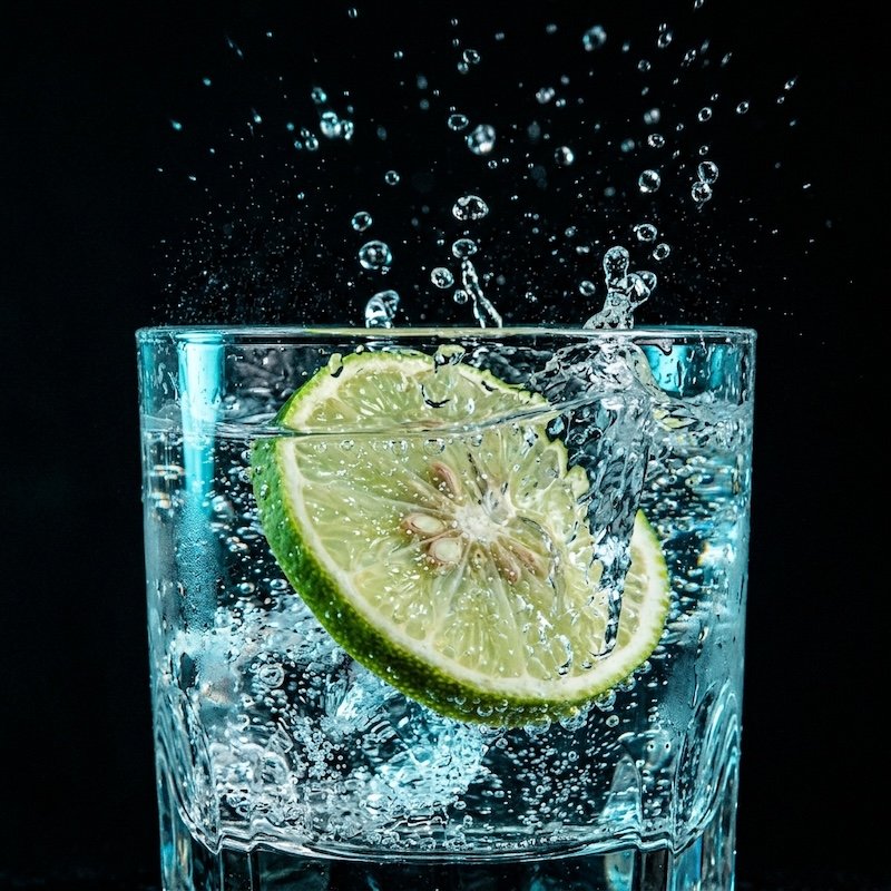 A citrus splash macro, duotone cyan.