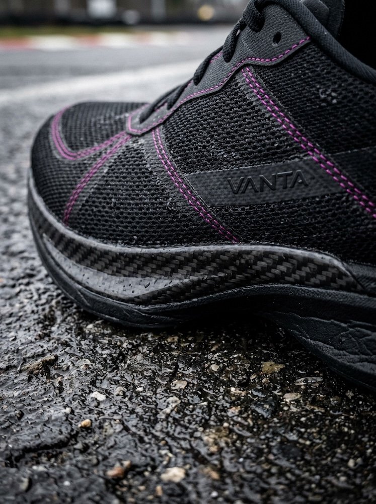 Macro detail of a VANTA racing shoe and technical fabric, duotone.